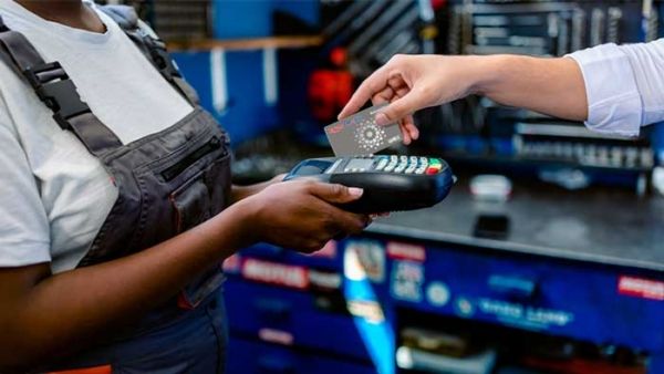 Technician processing payment with universal fleet card